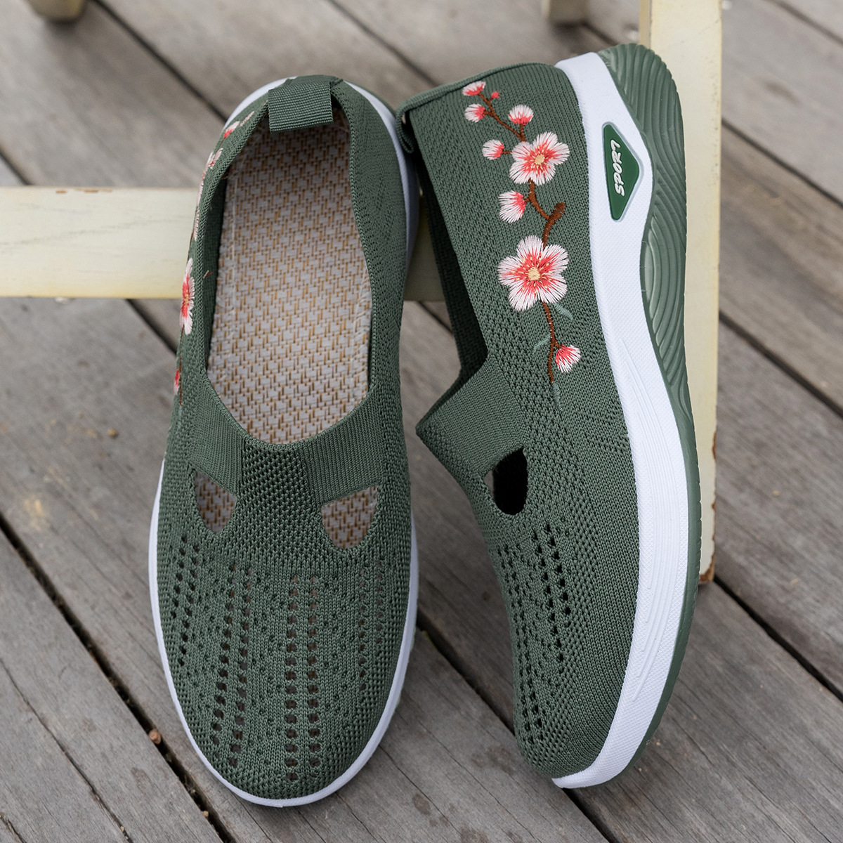 Side view of woman walking comfortably in floral wedge shoes