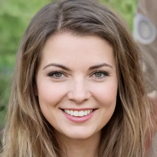 Young woman smiling, holding a skincare product
