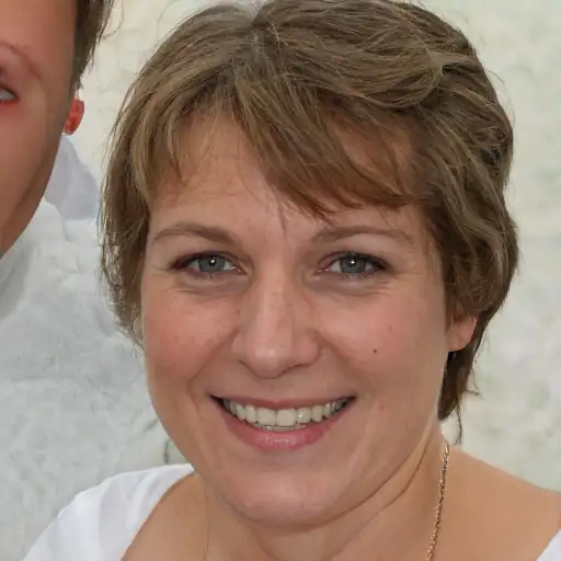 Smiling woman holding a portafilter