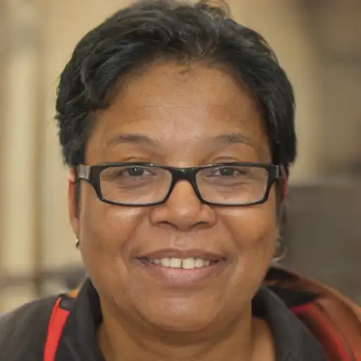 A woman in her 50s with noticeably reduced split ends.