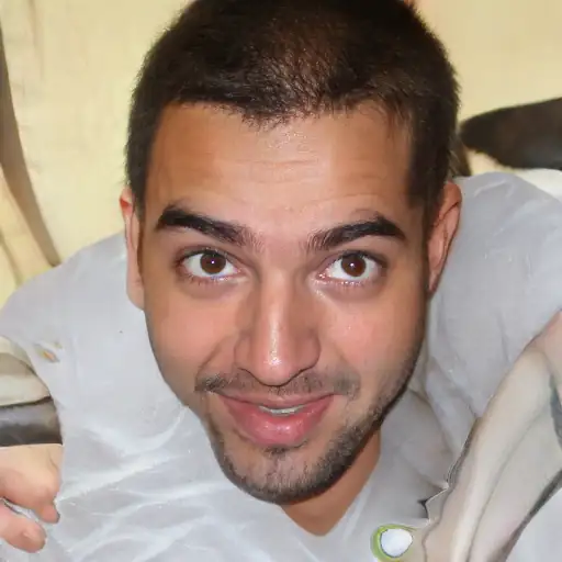 Young man smiling while holding the device highlighting the battery performance and ergonomic design for better productivity