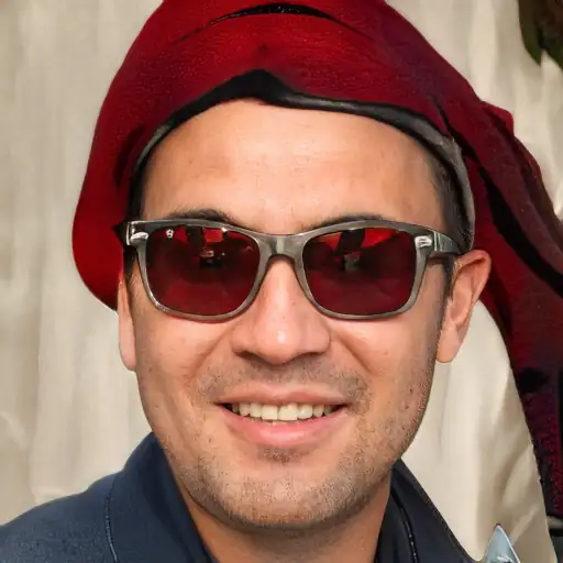 A young East Asian man smiling at his dog.