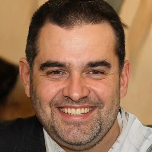 A man in his 40s looking well-rested.