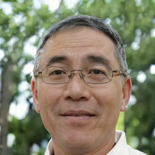 An East Asian man in his 50s with smooth, healthy-looking skin.