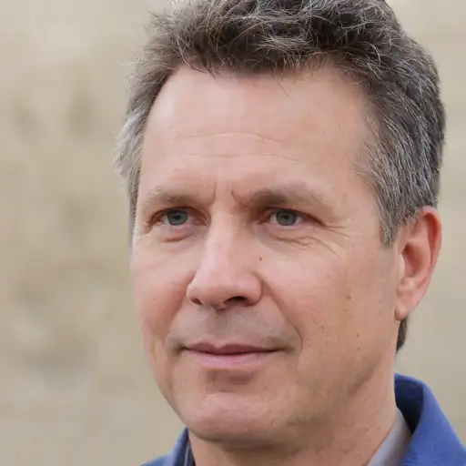 Profile picture of a man in his 50s looking content