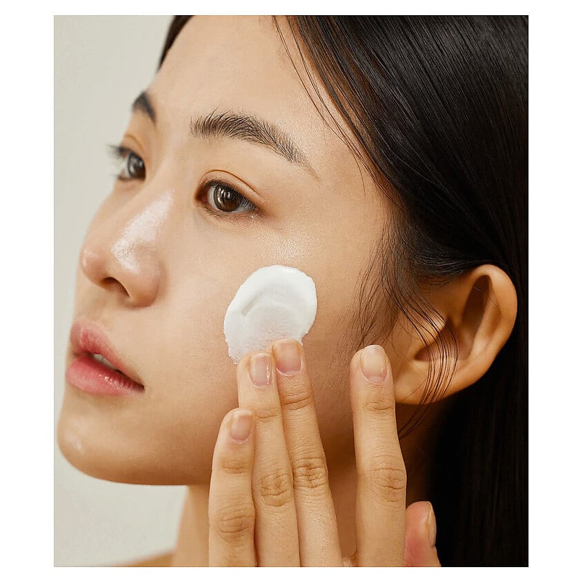 Nourishing serum by Beauty of Joseon with a backdrop of nature