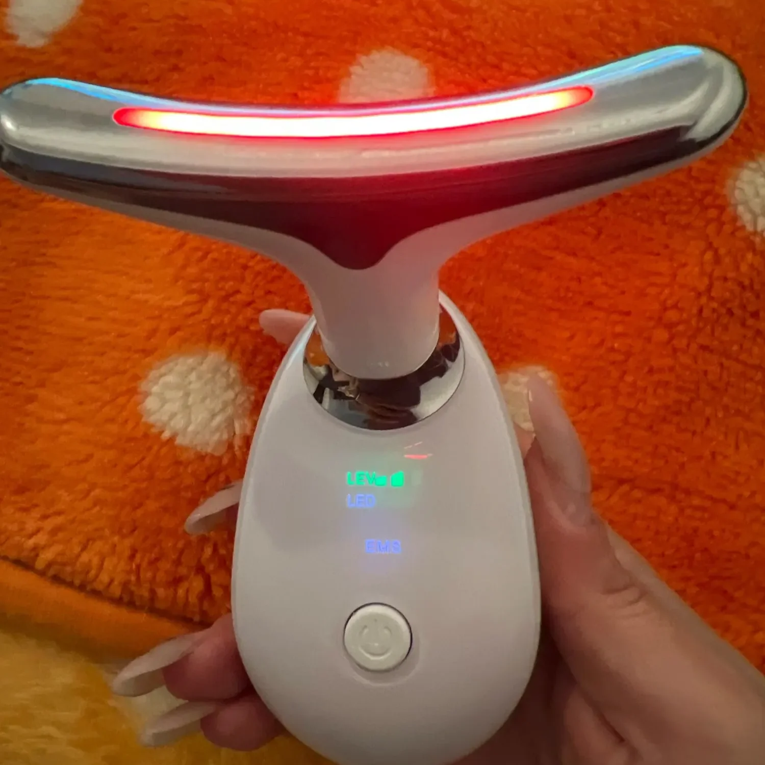 Close-up of The Neck Sculptor device gently gliding along a woman's neck