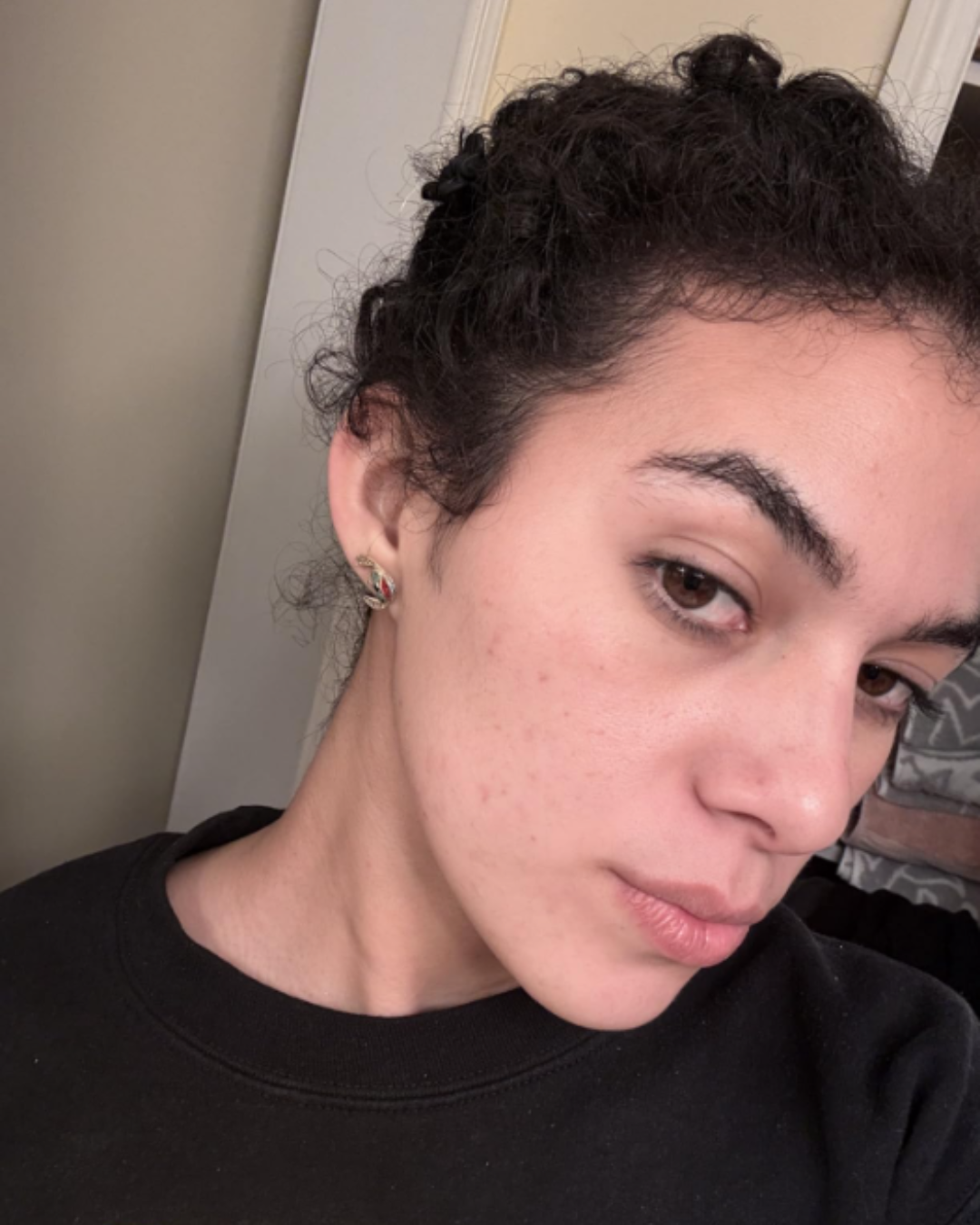 Woman with clear, hydrated skin after using the SKIN1004 Madagascar Centella Travel Kit.