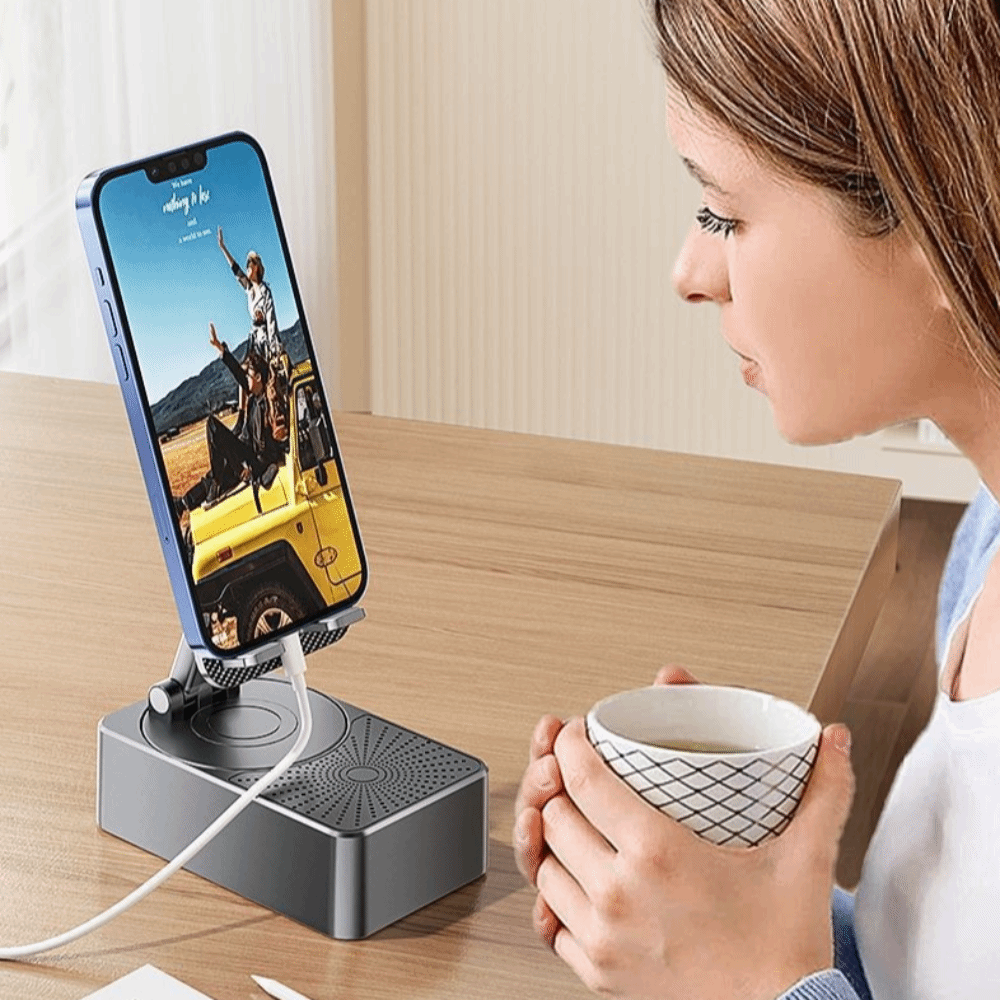 Multi-functional cell phone stand with speaker