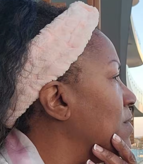 Image of a satisfied customer with glowing skin after using ProductX