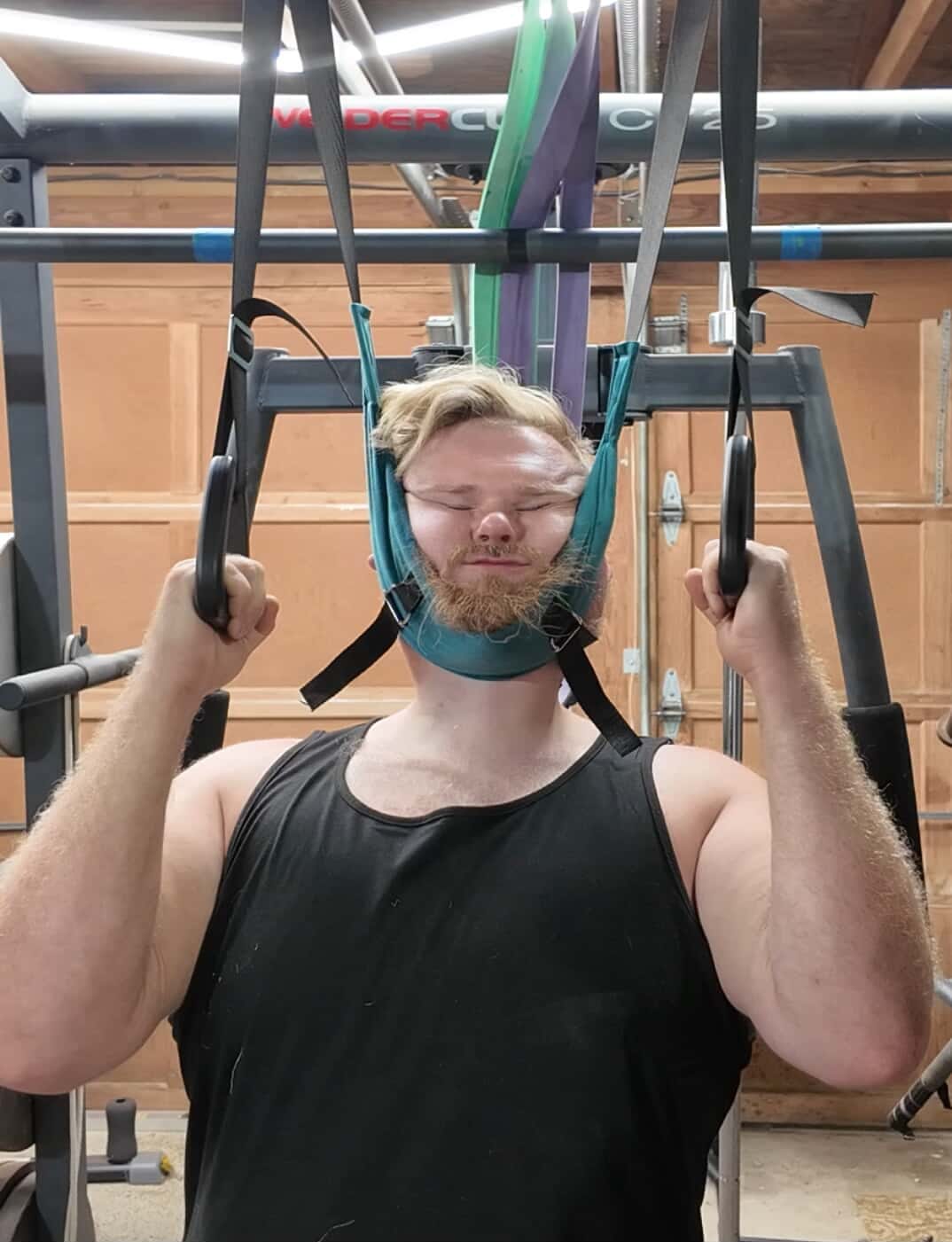 Hands easily adjusting a neck traction device strap.