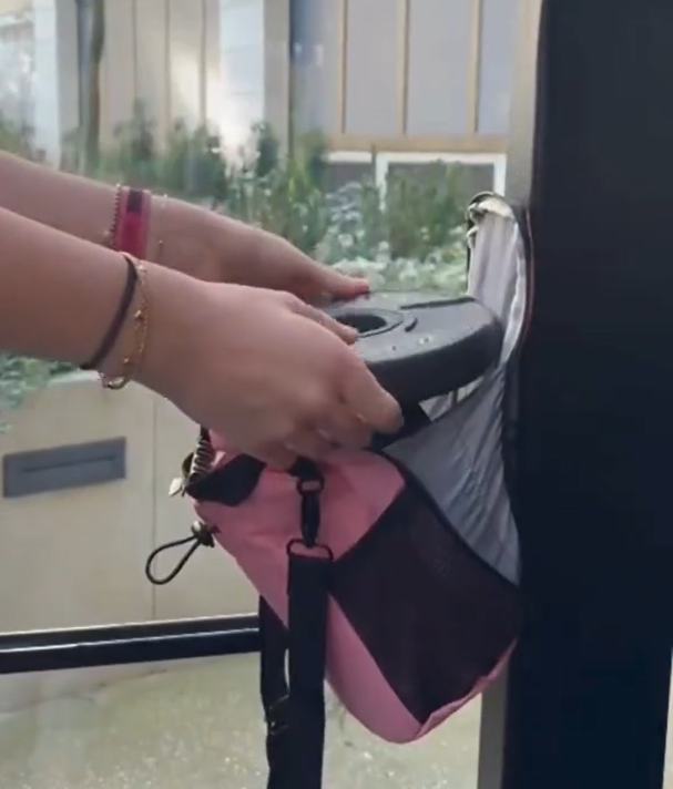 Magnetic holder securely attached to a metal bar during a workout