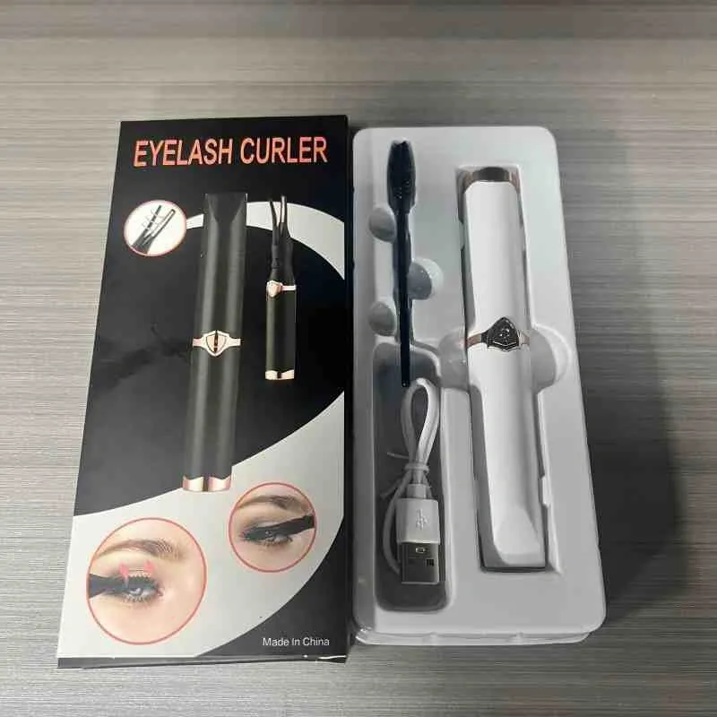 Person applying mascara to curled lashes