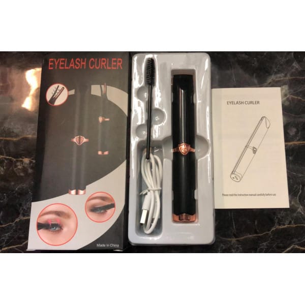 Product shot of the heated eyelash curler with USB-C cable