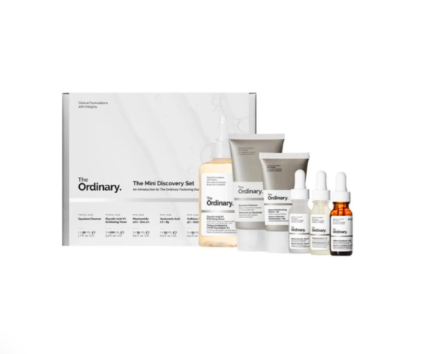 A minimalist flat lay of The Ordinary The Clear Set skincare products on a clean, white background.