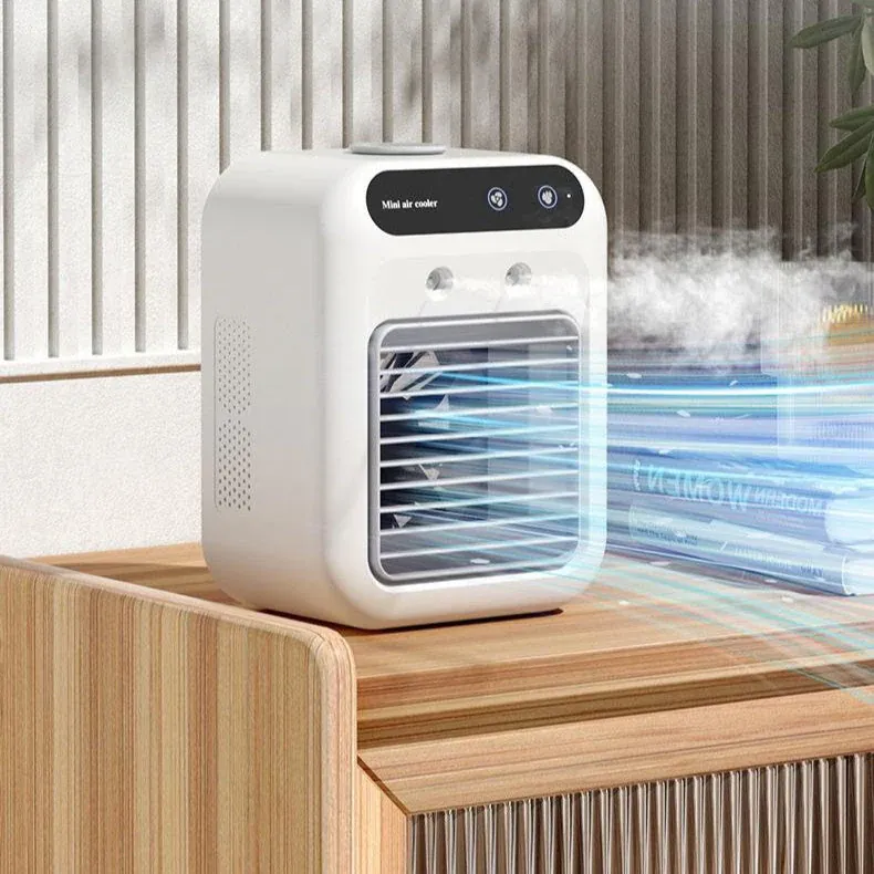 Mini air conditioner cooling a desk space