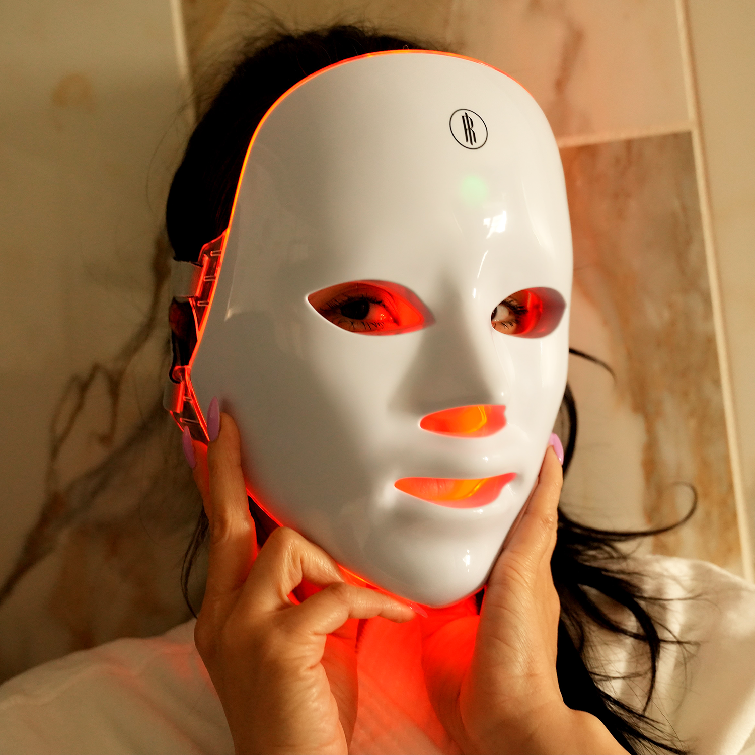 The Wireless LED Light Therapy Face Mask with seven color options displayed.