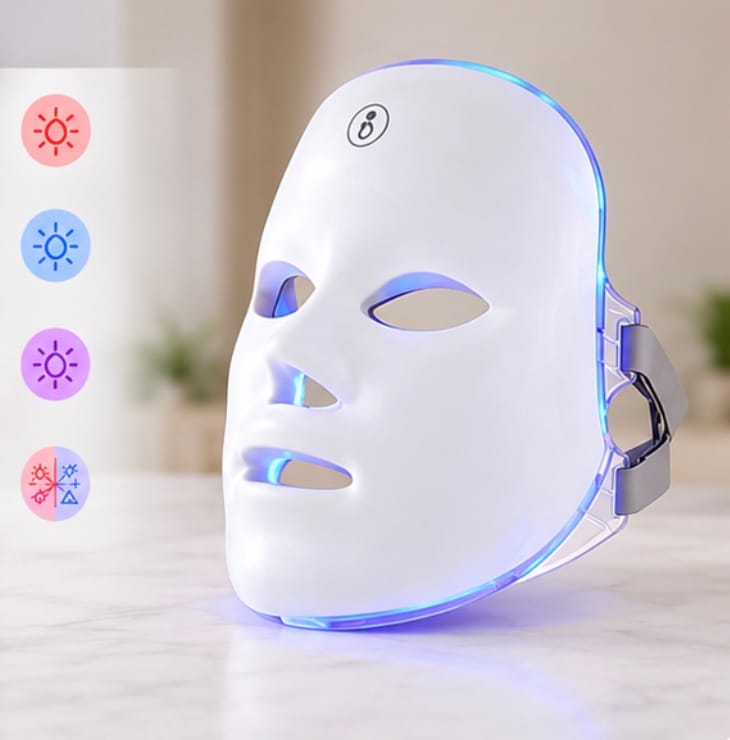Finger pressing button on LED mask to select color