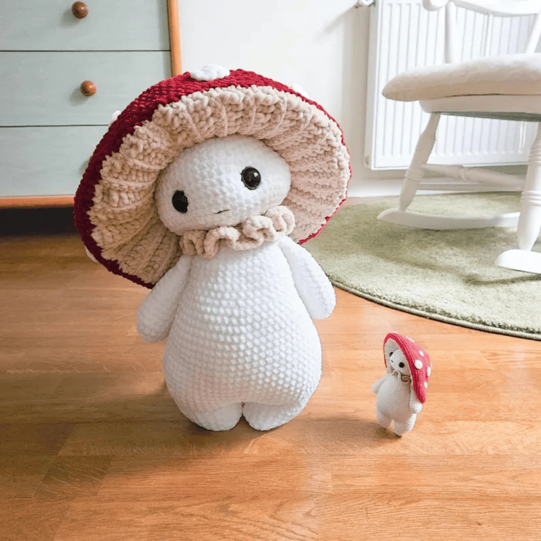 A collection of finished amigurumi animals, including a cat, dog, and rabbit, arranged on a shelf.