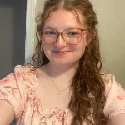 Smiling woman with crochet hook