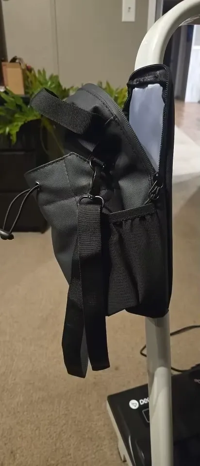 Man hiking with magnetic water bottle holder on backpack