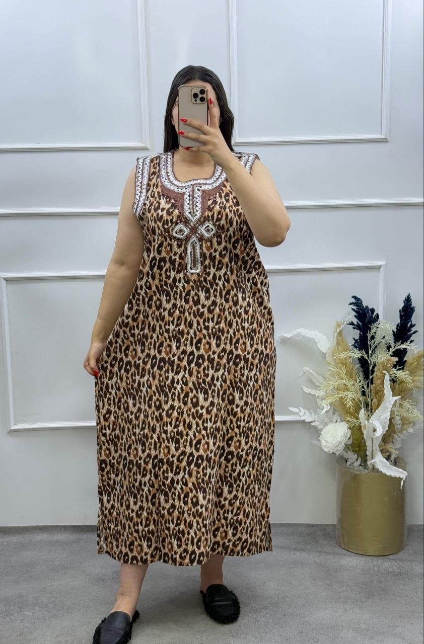 Woman wearing a leopard print Moroccan style house dress relaxing at home
