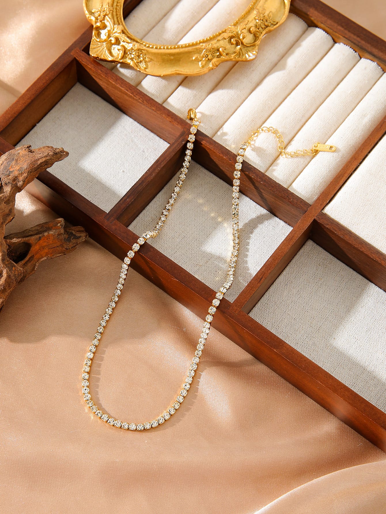 Elegant gold necklace on casual outfit