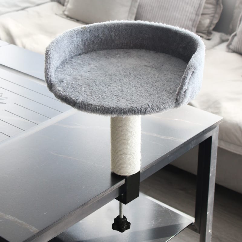 Cat sleeping comfortably in a desk mounted bed