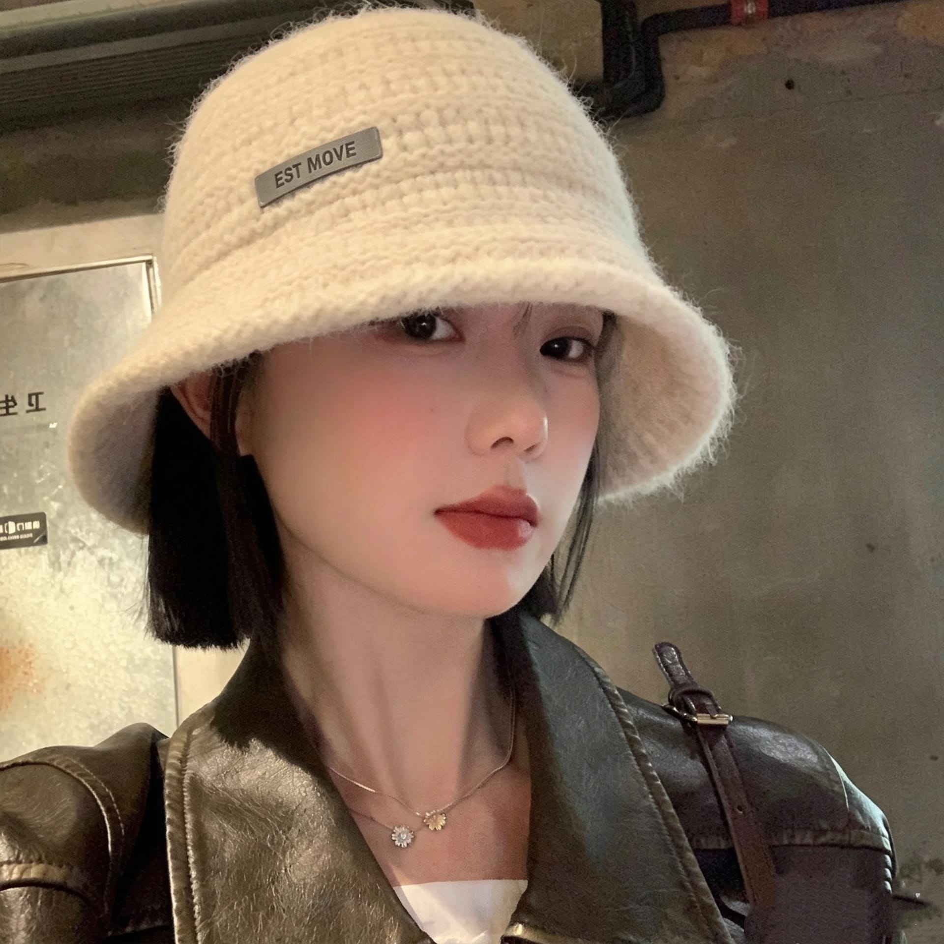 Woman wearing a cozy Maillard retro knitted bucket hat outdoors